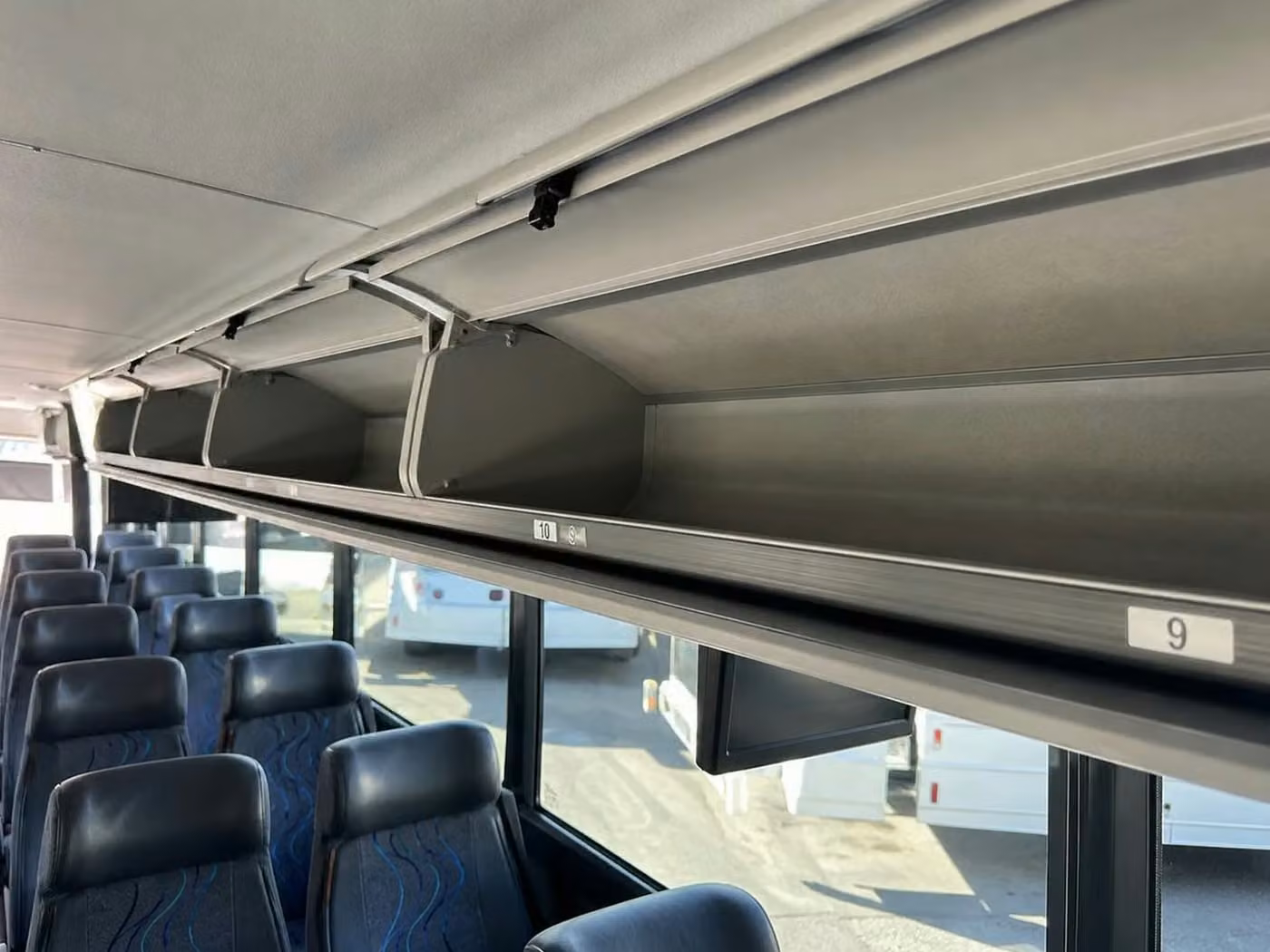 hammond 56 passenger charter bus overhead storage